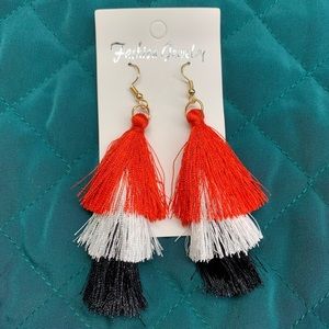 Red, white and black tassel earrings.